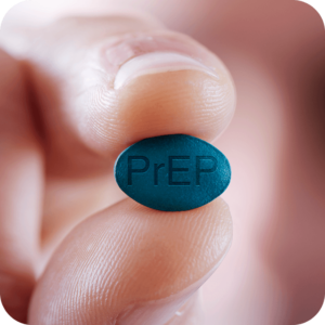 Zoomed in image of a blue pill that reads "PrEP"